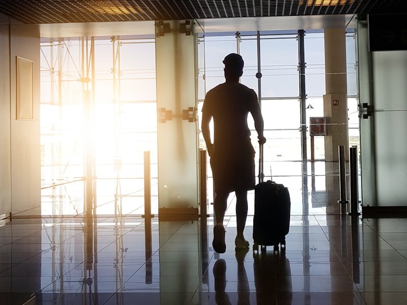 Traveller with luggage at an airport